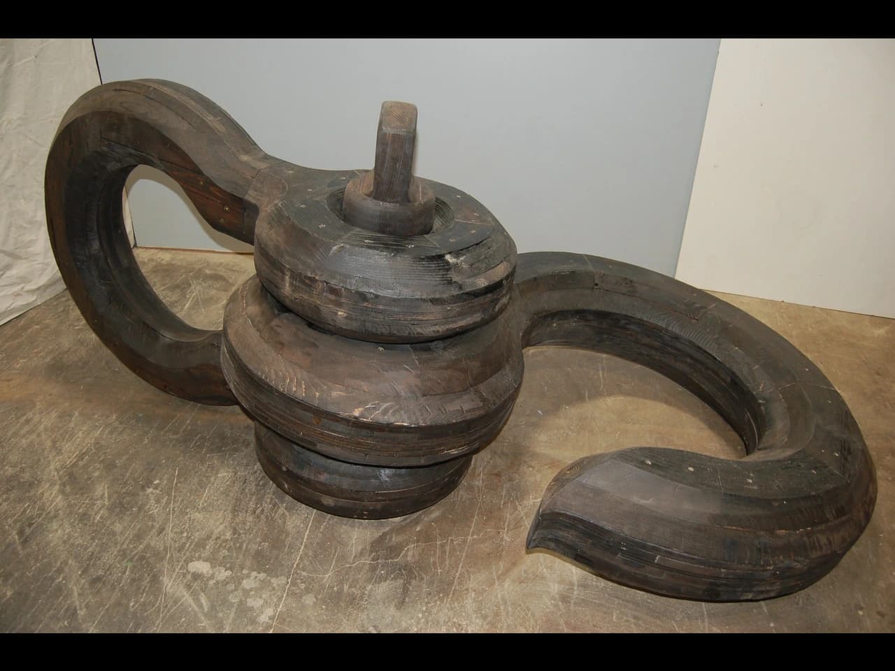 Norman Ed, hook and shackle, 2026, Wood, glue, steel fasteners, paint, 43 x 48 x 105", $2500