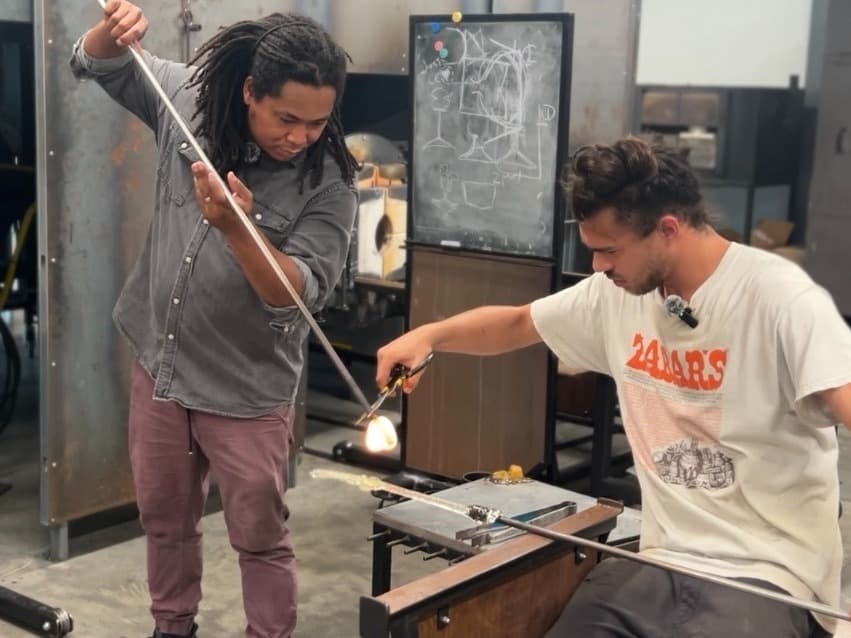 Artists Chris Ross and Leo Fine preparing work at the Pittsburgh Glass Center.