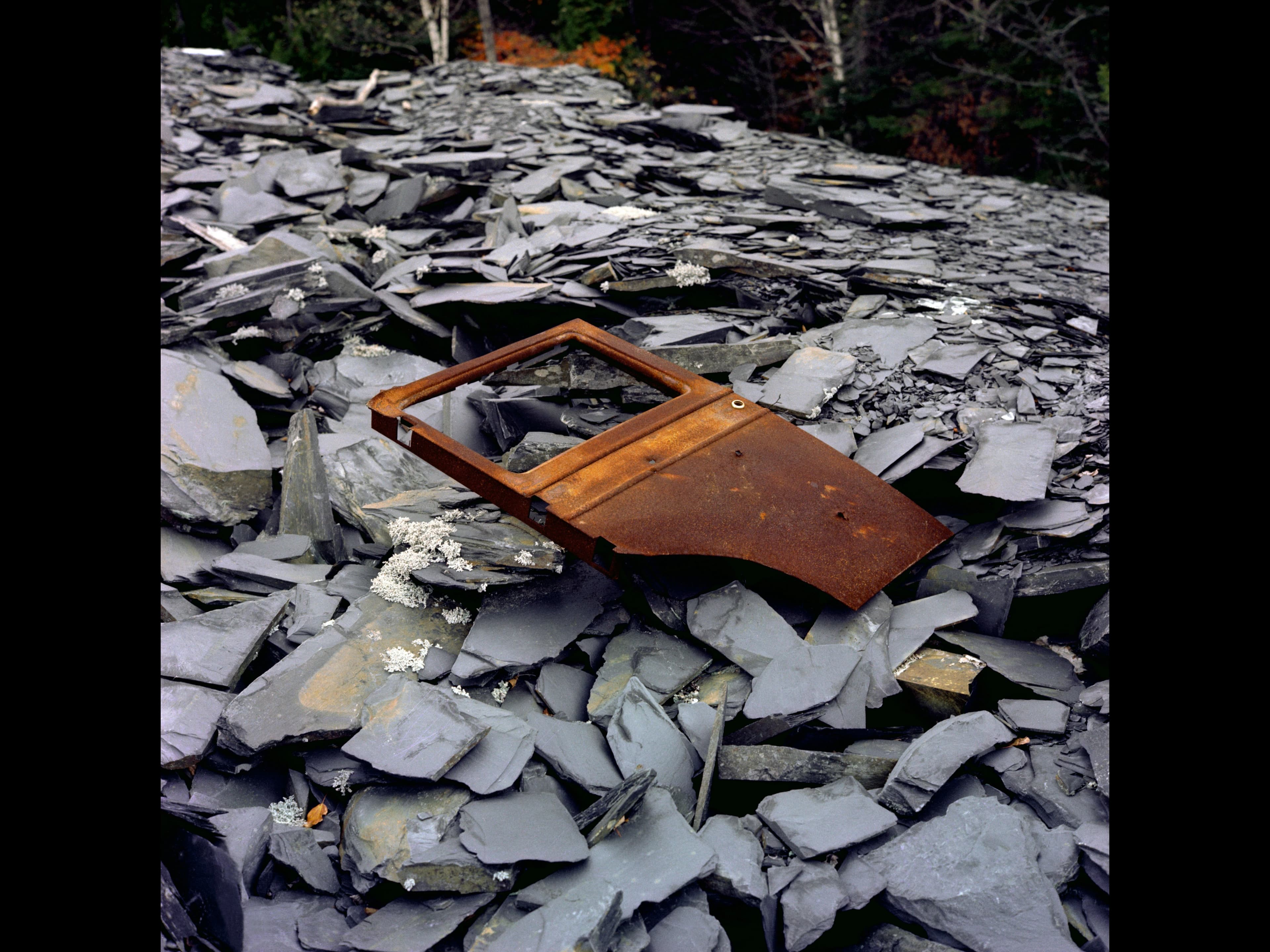 Hank O’Neal, Slate Dump and Rusted Automobile Door, near Monson, 1978. Photograph (vintage negative/modern print). Courtesy of the artist